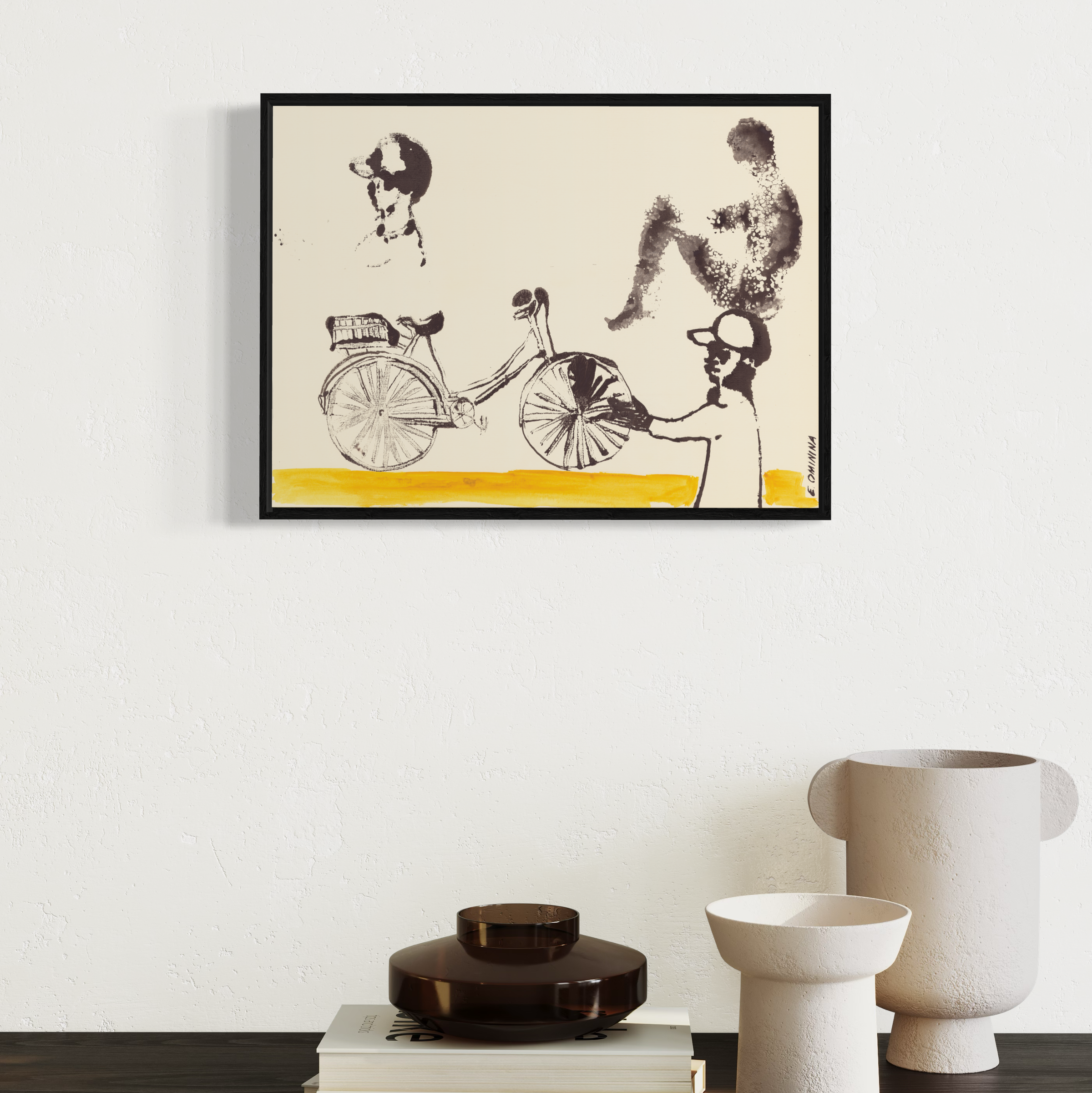 Framed artwork of a stylized illustration on a wall above decorative items.
