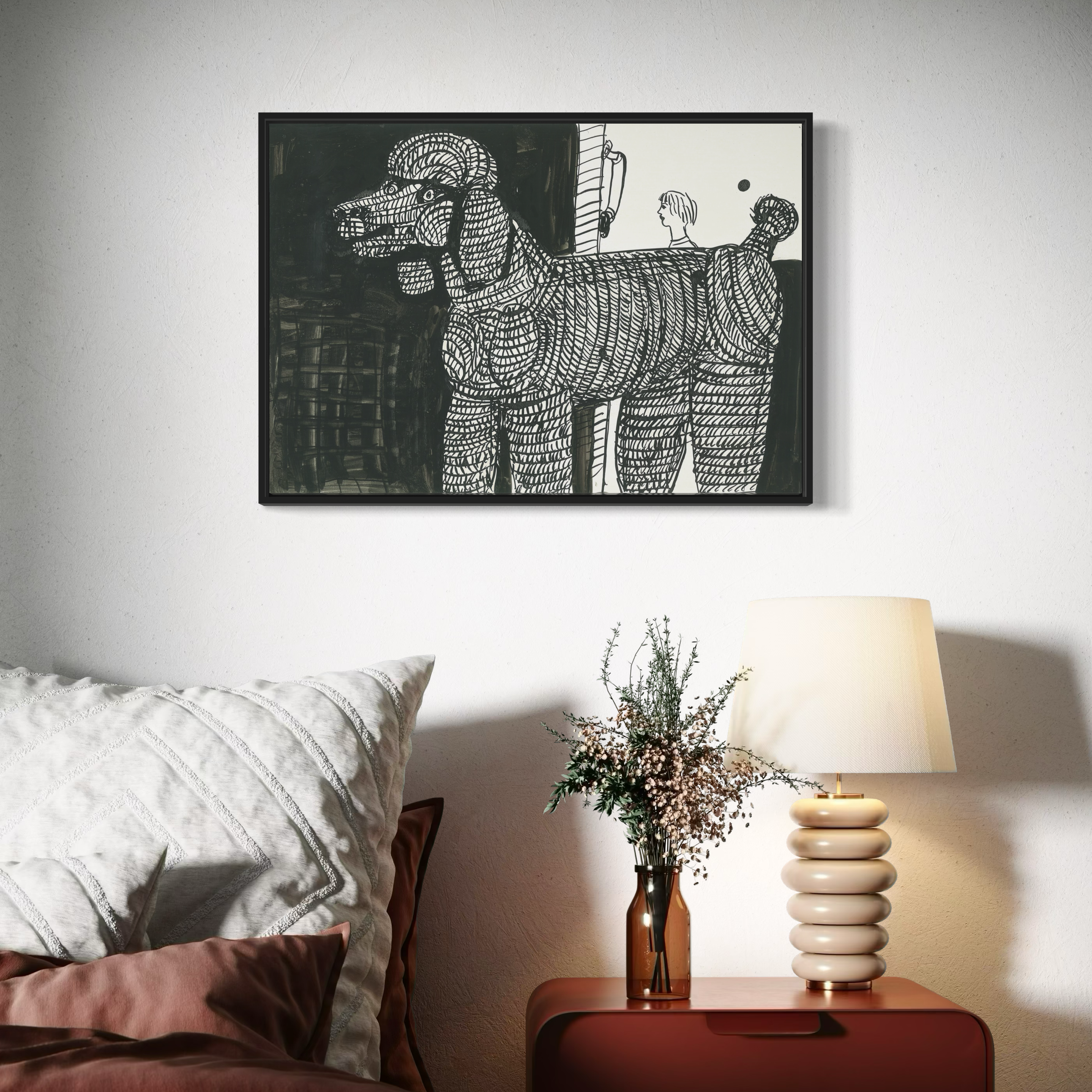 A bedroom with a framed black and white poodle dog art print above a bed, a lamp, and a vase on a nightstand.