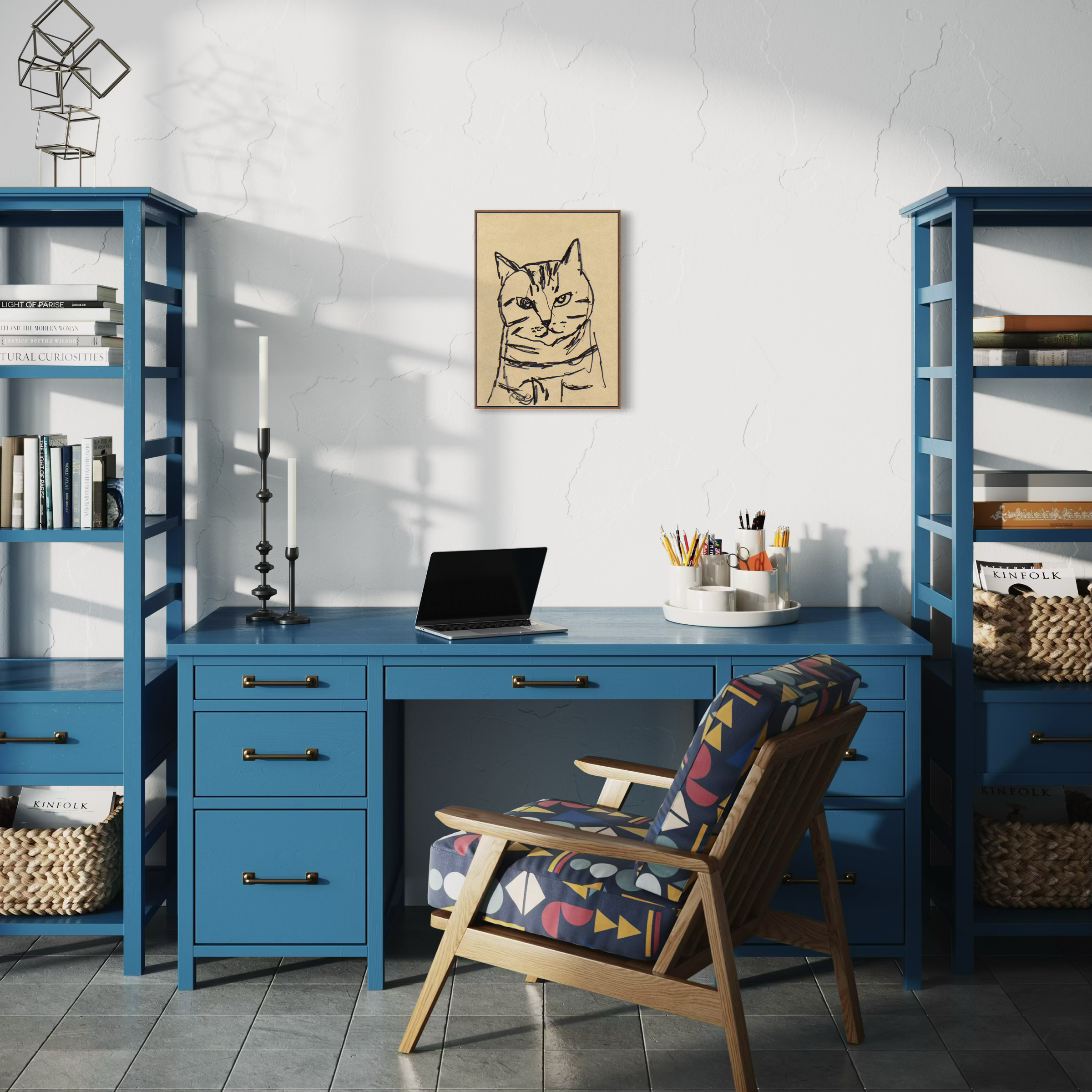 Home office art print next to the blue desk, chair, and shelves.